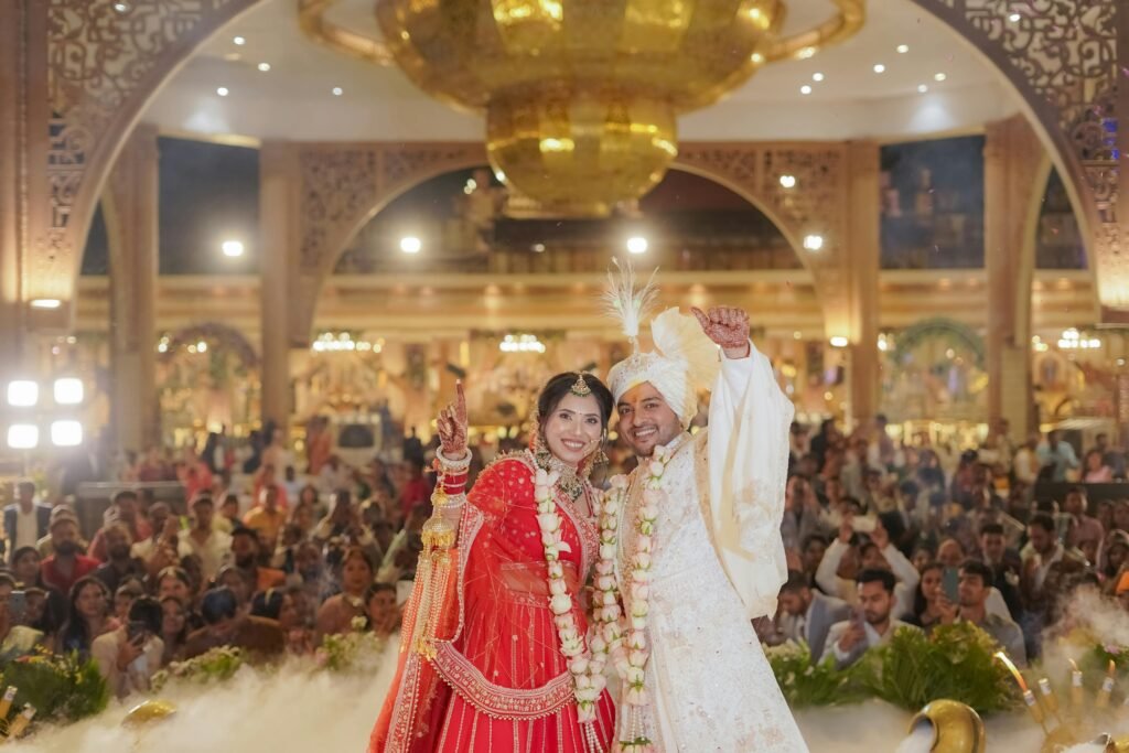 Indian couple celebrating wedding ceremony in traditional attire in Delhi, India.